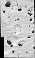 Iapetus with impact craters filled with dark material at the edge of Regio Cassini