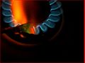 The green flame in the aluminium foil dish is the tin(II) oxide burning