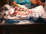 Nurse helping baby