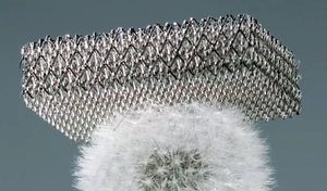 Microlattice sample sits on top of a dandelion.