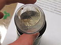 Tin(II) oxide hydrate, a pale white solid